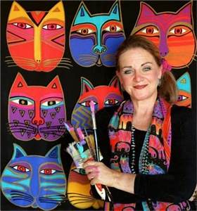 photo of Laurel Burch with paint brushes; cats in background