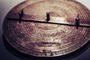 round engraved stone showing time divisions