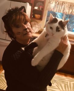 Halloween cat lady and white & black cat