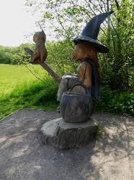 statue of witch, cat, cauldron