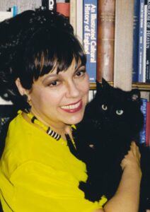 Woman holding black cat
