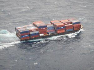 Barge traveling, filled with containers