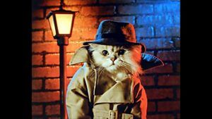 Cat dressed in detective attire