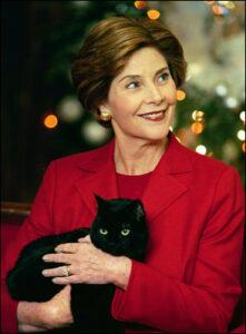 Laura Bush holding India, a black cat