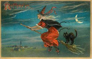 A witch riding broom with black cat