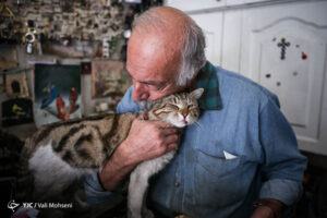 Old man loving cat