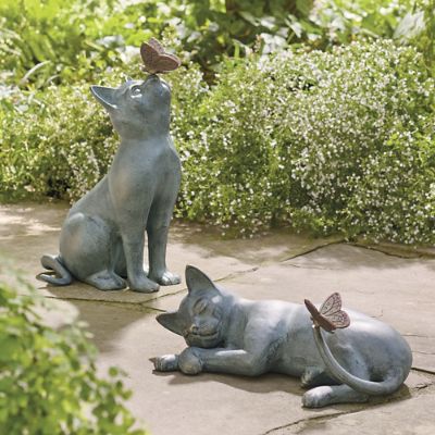 Cat statues with butterflies