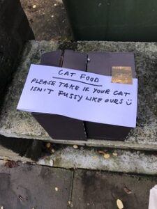 Sign offering food to non-picky cat eaters
